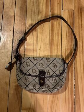 Authentic Dooney and Bourke Monogram Crossbody Bag with Dark Brown Trim